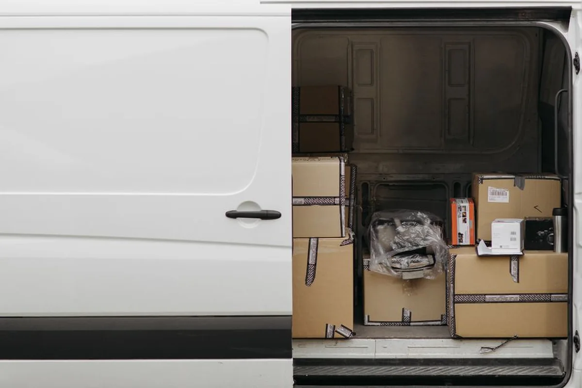 Parcels loaded inside an unbranded delivery van
